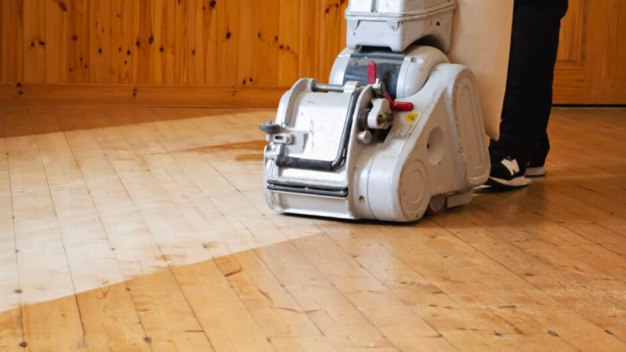 Stamford Hill Pine Floorboards – Mid-Process Wood Floor Sanding Wood Floor Sanding machine smoothing solid pine floorboards mid-process in a Stamford Hill room.