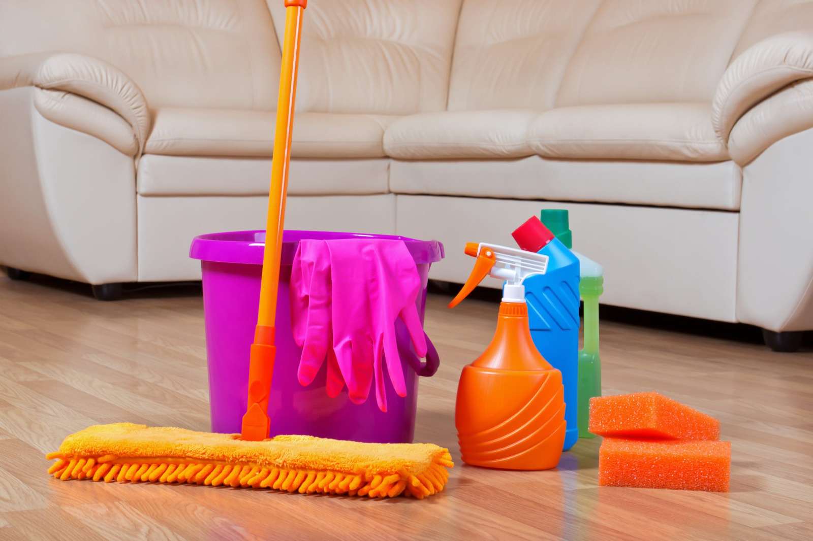 Hardwood Floor Refinishing in Stamford Hill – light oak hardwood floor aftercare with mop, bucket, gloves and neutral cleaner on a freshly sealed surface.